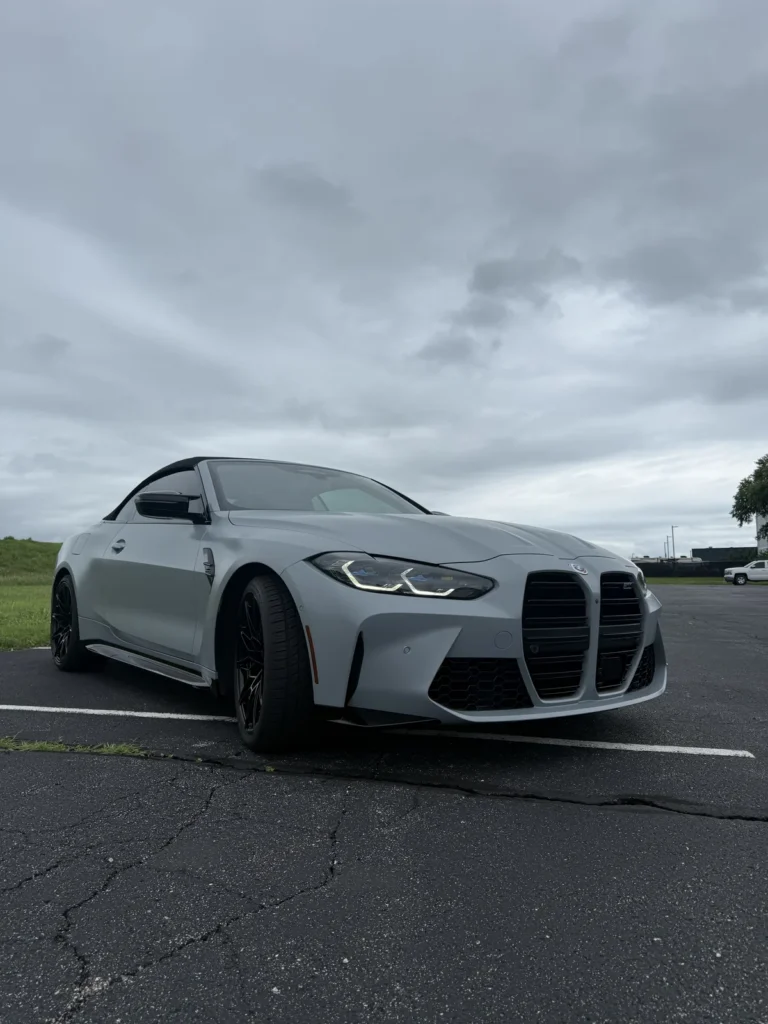 Gray BMW M performance coupe, front quarter view