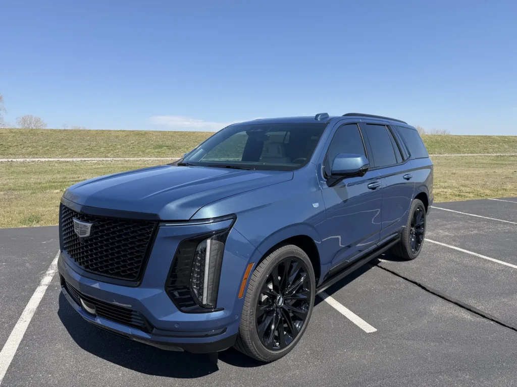 Customized Cadillac Escalade with blacked-out grille, front view