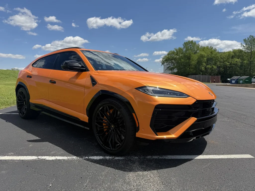 Orange Lamborghini Urus, front quarter view